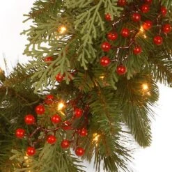 24" Feel Real® Classical Collection Wreath With Red Berries, Cedar Leaves & Warm White LED Lights 9 24" Feel Real® Classical Collection Wreath With Red Berries, Cedar Leaves & Warm White LED Lights -Michaels Store D206637S 3