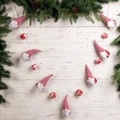 Glitzhome® 6ft. Red & White Fabric Christmas Gnome Garland, 2ct. 11 Glitzhome® 6ft. Red & White Fabric Christmas Gnome Garland, 2ct. -Michaels Store D445245S 2