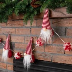 Glitzhome® 6ft. Red & White Fabric Christmas Gnome Garland, 2ct. 13 Glitzhome® 6ft. Red & White Fabric Christmas Gnome Garland, 2ct. -Michaels Store D445245S 4