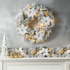 Glitzhome® 24" Pre-Lit Snow Flocked Greenery Pine Poinsettia Christmas Wreath & Matched 2 Pack 9ft. Garland Set -Michaels Store D652258S 3