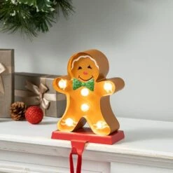 Glitzhome® 7.25'' Marquee LED Gingerbread Man Christmas Stocking Holder 11 Glitzhome® 7.25'' Marquee LED Gingerbread Man Christmas Stocking Holder -Michaels Store D652343S 2