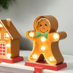 Glitzhome® Marquee LED Gingerbread House & Gingerbread Man Christmas Stocking Holder Set 14 Glitzhome® Marquee LED Gingerbread House & Gingerbread Man Christmas Stocking Holder Set -Michaels Store D652344S 5