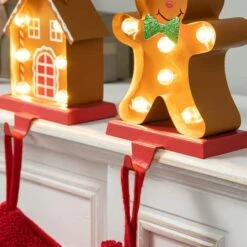 Glitzhome® Marquee LED Gingerbread House & Gingerbread Man Christmas Stocking Holder Set 15 Glitzhome® Marquee LED Gingerbread House & Gingerbread Man Christmas Stocking Holder Set -Michaels Store D652344S 6