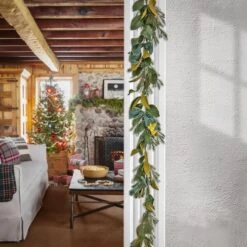 9" Christmas Magnolia Mix Pine Garland With Fabric Bow, Warm White LED Lights 9 9" Christmas Magnolia Mix Pine Garland With Fabric Bow, Warm White LED Lights -Michaels Store D675899S 2