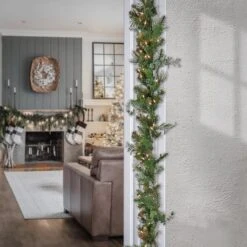 First Traditions™ Collection 9ft. Pre-Lit Artificial North Conway Garland With Glittery Cones & Eucalyptus, 100 Warm White LED Lights 7 First Traditions™ Collection 9ft. Pre-Lit Artificial North Conway Garland With Glittery Cones & Eucalyptus, 100 Warm White LED Lights -Michaels Store D675900S 2