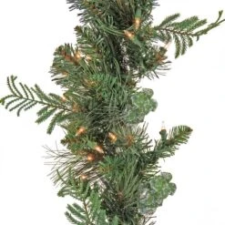 First Traditions™ Collection 9ft. Pre-Lit Artificial North Conway Garland With Glittery Cones & Eucalyptus, 100 Warm White LED Lights 8 First Traditions™ Collection 9ft. Pre-Lit Artificial North Conway Garland With Glittery Cones & Eucalyptus, 100 Warm White LED Lights -Michaels Store D675900S 3