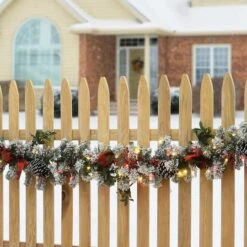 9ft. General Store Snowy Garland With LED Lights & Bows -Michaels Store D675916S 2